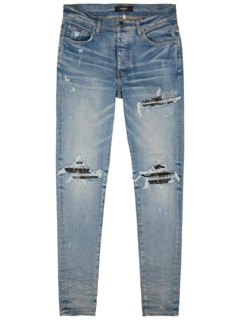 MX1 distressed skinny jeans
