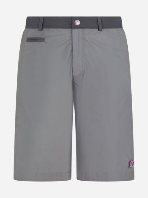 Dolce & Gabbana Mid-length swim trunks with metal DG logo
