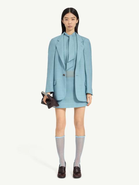 MM6 Maison Margiela A flattened silhouette reworks classic tailoring by pressing structure into a more two-dimensional f