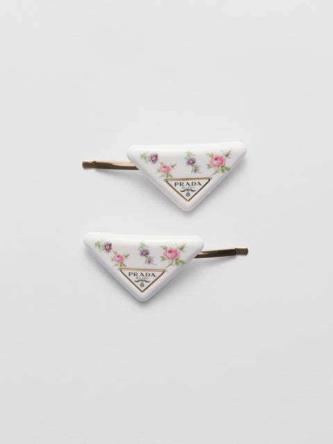 Prada Plexiglas and metal hair barrettes