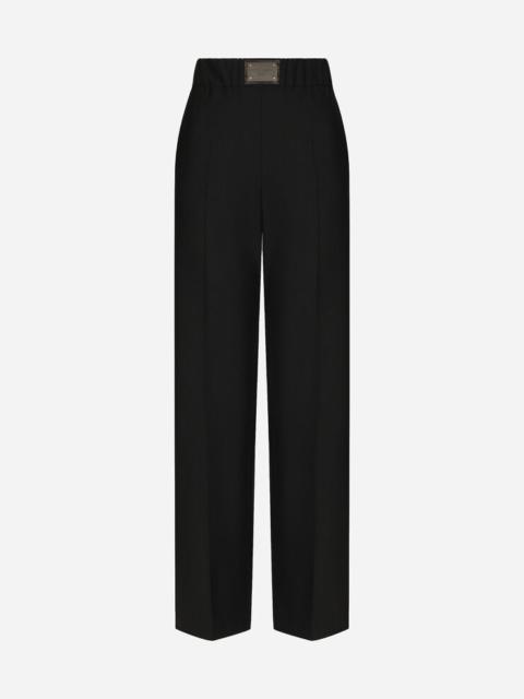 Flared wool pants with logo tag