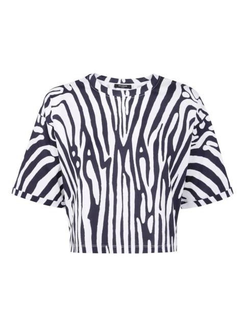 Balmain Introducing the BALMAIN ZEBRA PRINT CROP T-SHIRT, a stunning addition to your wardrobe from the icon