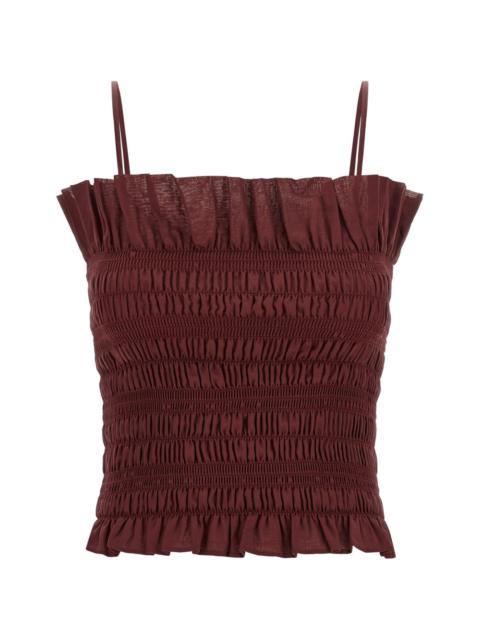 THE ANDAMANE Suri smocked ruffled sleeveless top