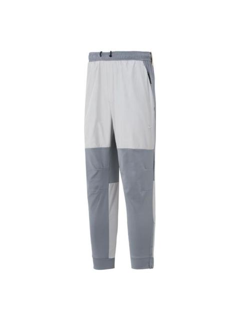 Nike Nike Unlimited Water-Repellent Zippered Cuff Versatile Pants Asia Sizing 'Grey White' FB8602-084