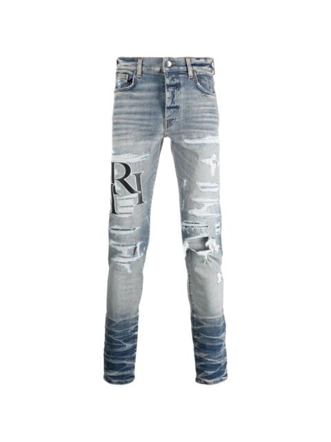 AMIRI logo-patch cotton-blend slim-fit jeans