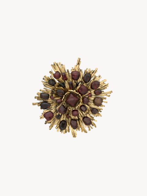 SAINT LAURENT SUNBURST BROOCH IN RESIN AND GLASS
