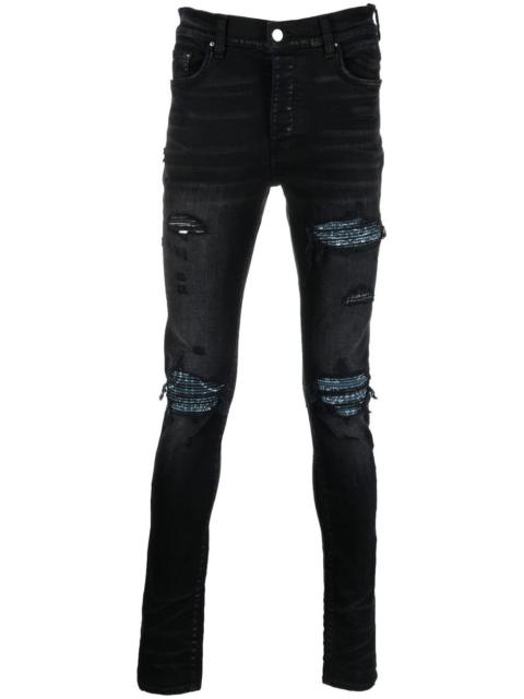 AMIRI distressed skinny jeans