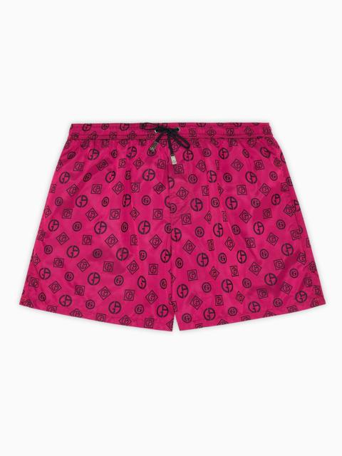 GIORGIO ARMANI Swim trunks with an all-over logo jacquard