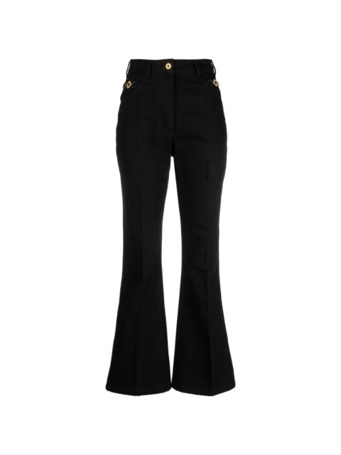 PATOU logo-embroidered flared jeans