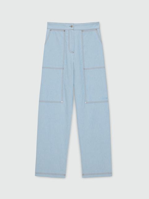 MSGM Oversized raw denim trousers with contrast stitching and metal rivets